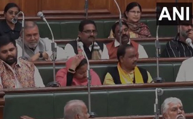 Bihar RJD MLAs Chetan Anand and Nilam Devi seen  sitting on government side in Bihar state assembly