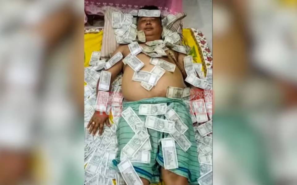 Assam: Suspended UPPL member's photo of sleeping with bundles of money stirs row