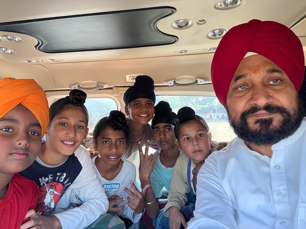 Village children ride helicopter with Punjab CM