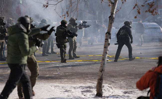 Protesters demand immigration agents leave Minneapolis after man is shot and killed during crackdown