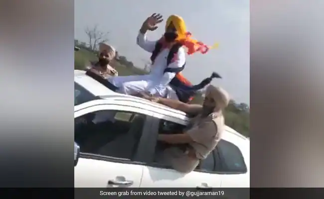 Punjab transport minister's undated video sitting on car sunroof triggers  row