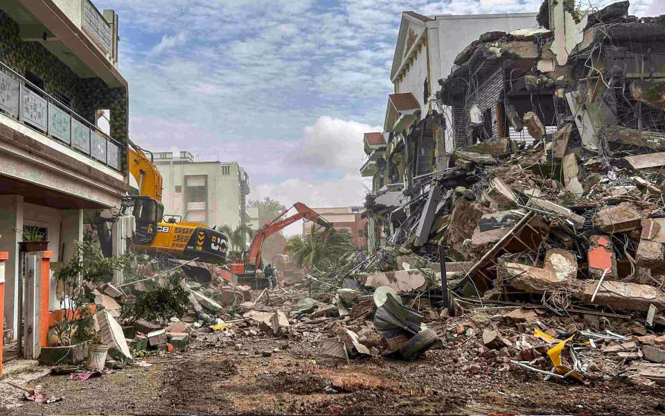 Civic authorities raze 36 illegal bungalows on bank of Indrayani river near Pune