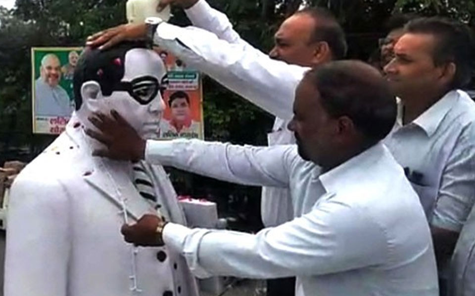 Dalit lawyers 'purify' Ambedkar statue after BJP leader garlands it