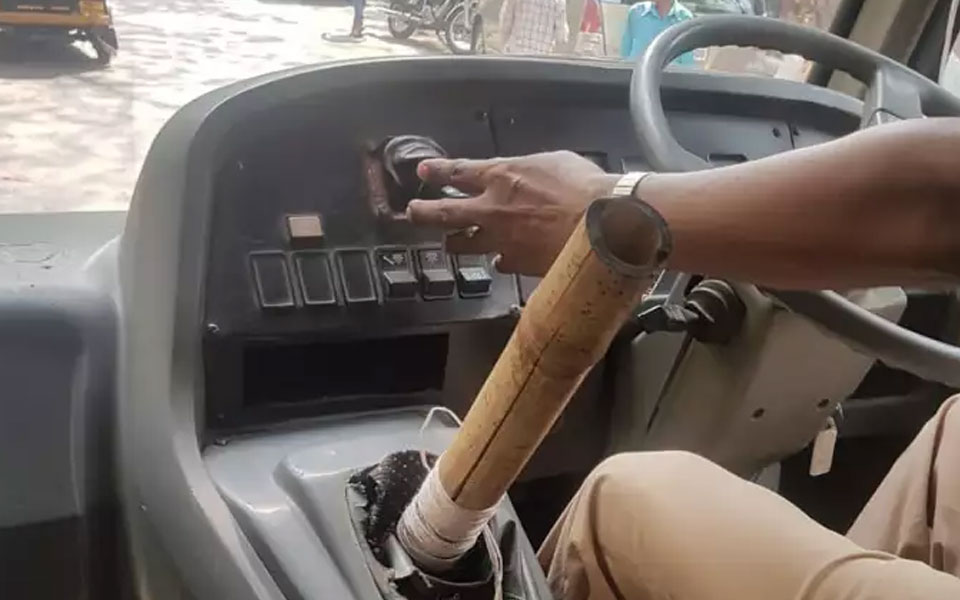 School bus driver using bamboo stick as gear hits car, held