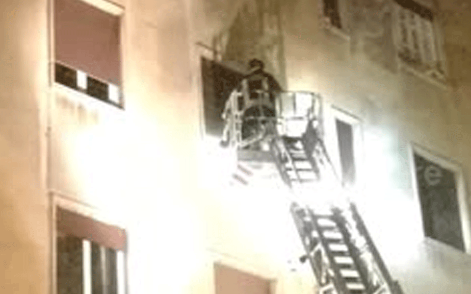 Cops, firemen thwart suicidal woman's bid to jump from flat