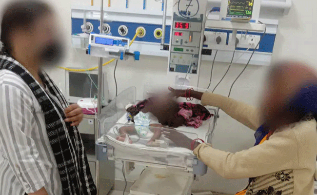 Body of baby who died after 'hot iron' treatment exhumed