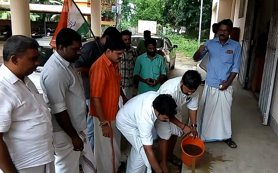 Youth Congress workers perform "purification ceremony" at sit-in protest spot of CPI Dalit MLA