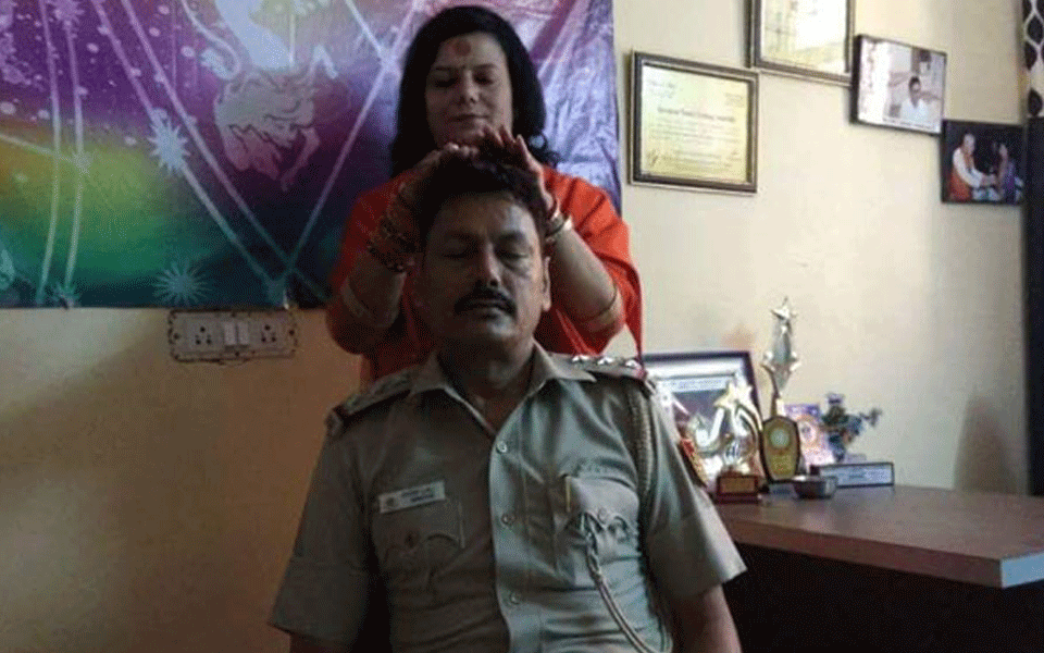 Cop transferred after picture with god woman goes viral