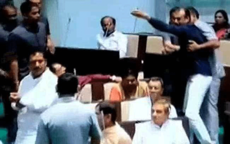 BJP, Congress MLAs fight in Gujarat Assembly; hurl microphones, abuses