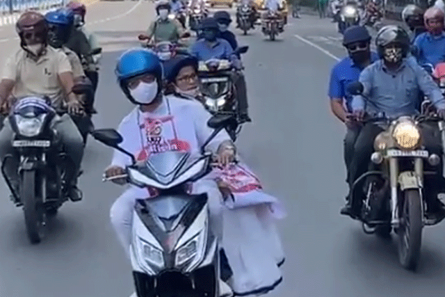 Mamata Banerjee rides pillion on electric scooter to protest fuel price hike