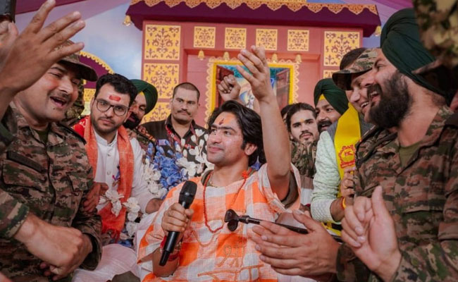 Army soldiers in uniform sit at feet of Dhirendra Shastri who vows to turn India into ‘Hindu Rashtra