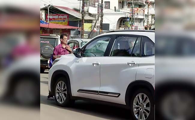 Man tries to block Union minister's car to give representation, pushed away by BJP workers