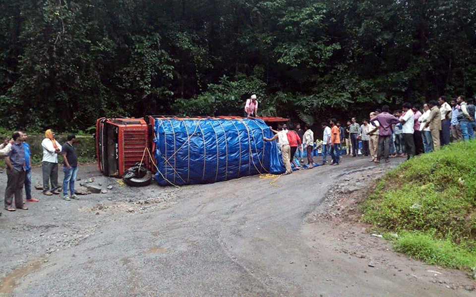 Truck carrying bananas flips over on Charmadi Ghat Road