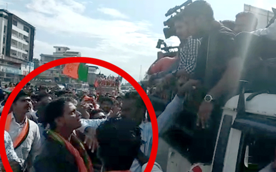 BJP workers try to assault scribes by pelting bottles at them