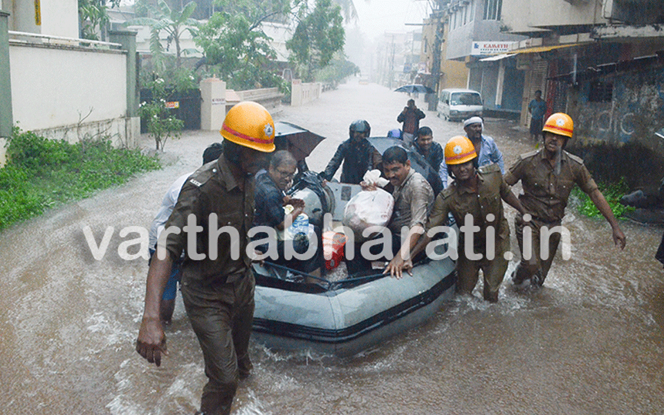 Incessant rain: Locals in Kudroli use boats