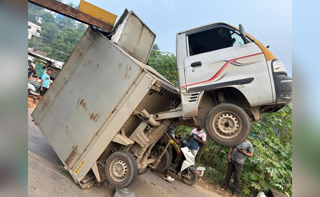 Speeding truck gets stuck in barrier of old bridge in Panemangalore; no casualties