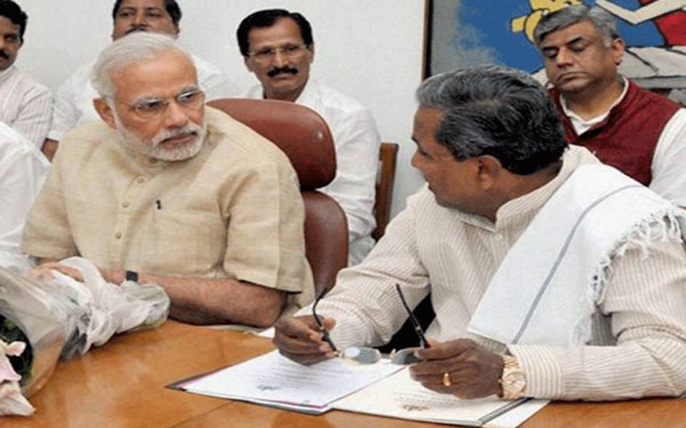 Now, Siddaramaiah asks Modi to speak for 15 minutes about Yeddyurappa’s achievements looking paper