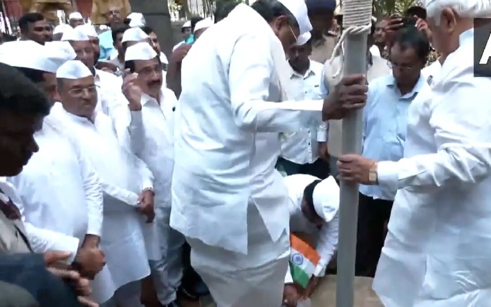 BJP urges CM to apologise after party worker seen removing his shoes with national flag in hand