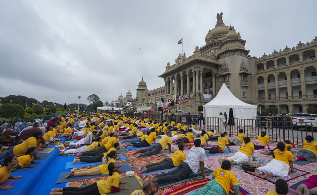 Karnataka Guv, health minister perform yoga in Bengaluru