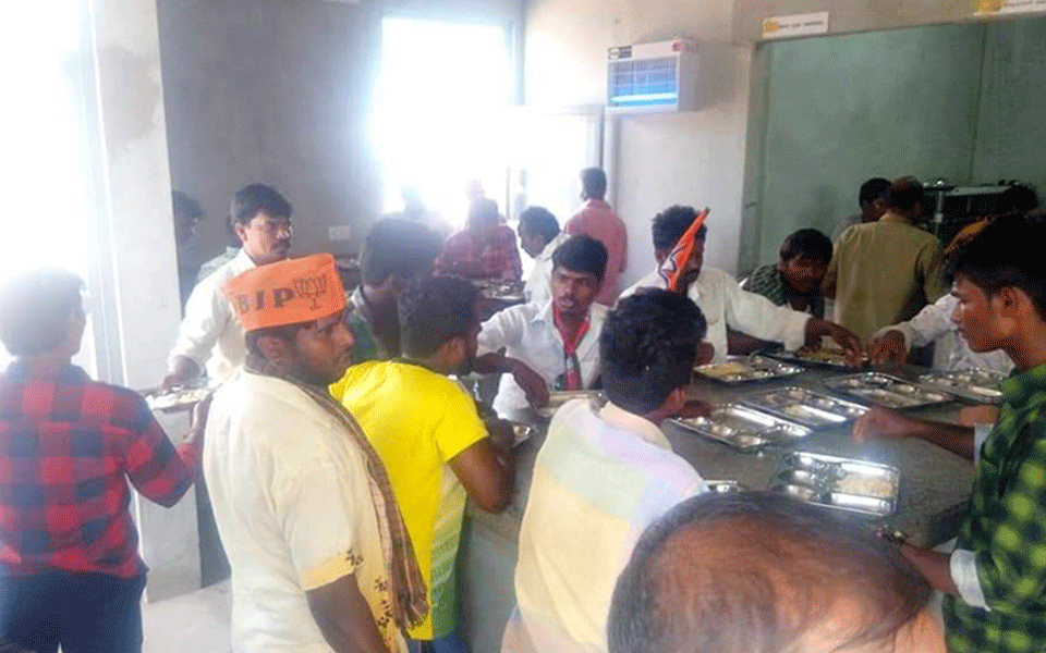 BJP workers take food at Indira canteen