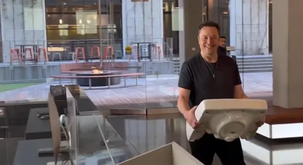 Elon Musk posts video of himself strolling into Twitter HQ