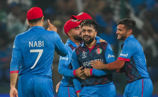 Afghanistan stun defending champions England by 69 runs in huge World Cup upset.