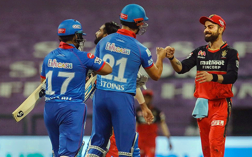 Delhi Capitals grab top-two finish with six-wicket win, RCB also through to playoffs