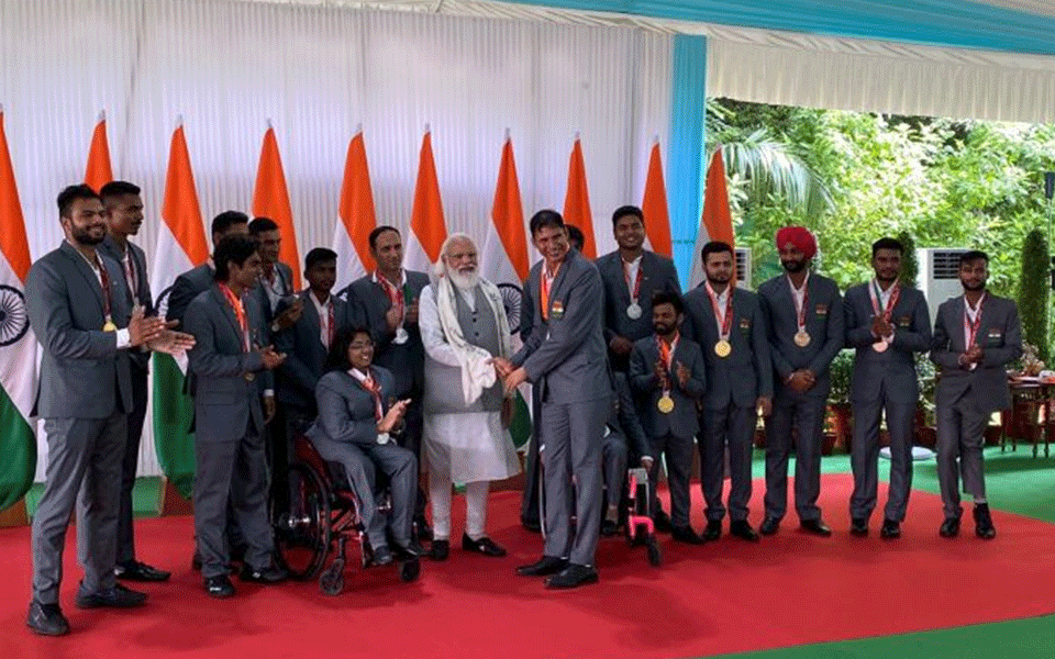 PM Modi hosts India Paralympic contingent, presented with autographed stole