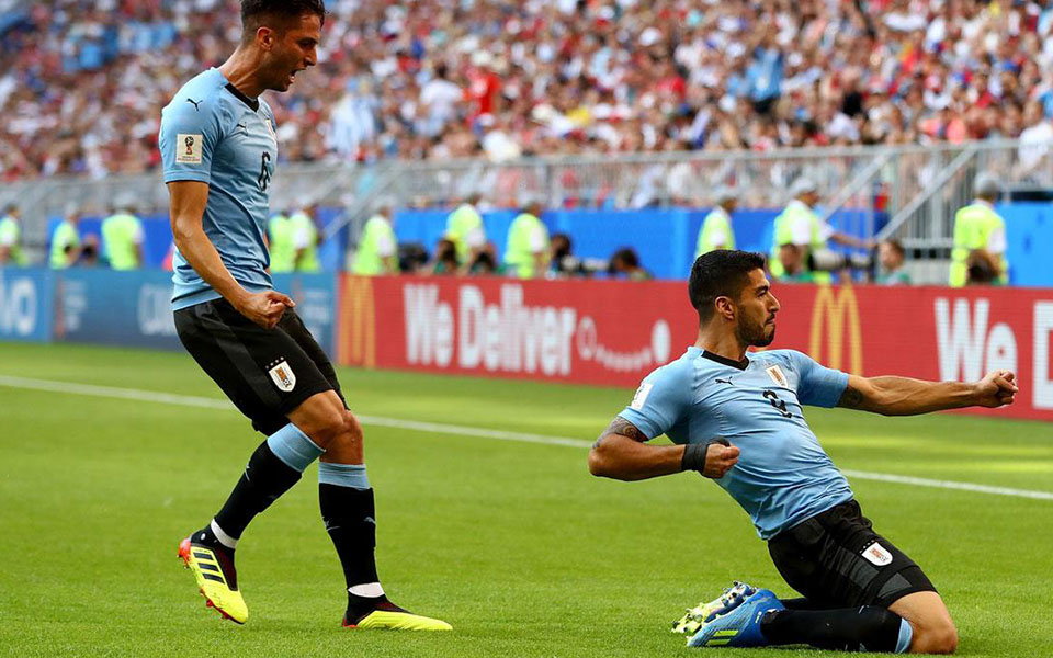 Uruguay beat Russia 3-0 to top Group A