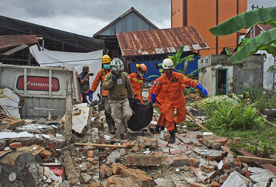 At least 42 dead as Indonesia quake topples homes, buildings