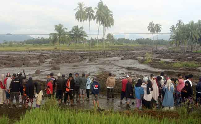 Flash floods and cold lava flow hit Indonesia's Sumatra island, killing at least 15 people