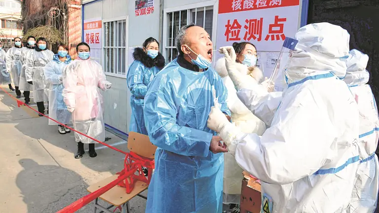 China reports over 100 COVID-19 cases amid virus spike