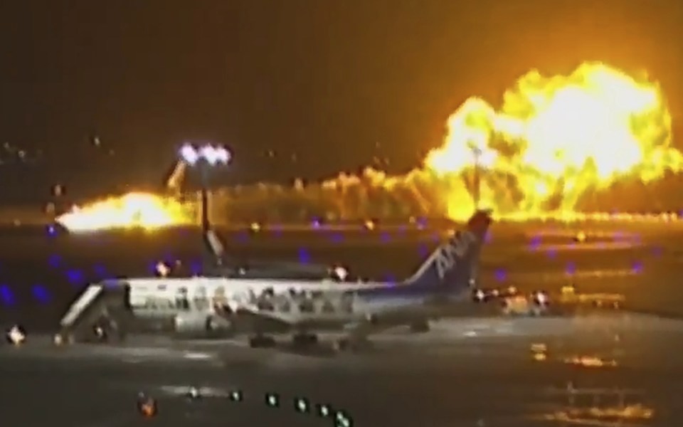 Planes collide and catch fire at Japan's busy Haneda airport, killing 5, Hundreds evacuated safely