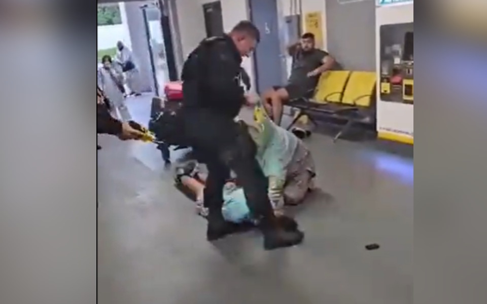 Viral video shows police officer kicking young man in face at Manchester Airport