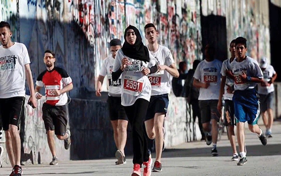 Thousands run for freedom of movement in Palestine marathon