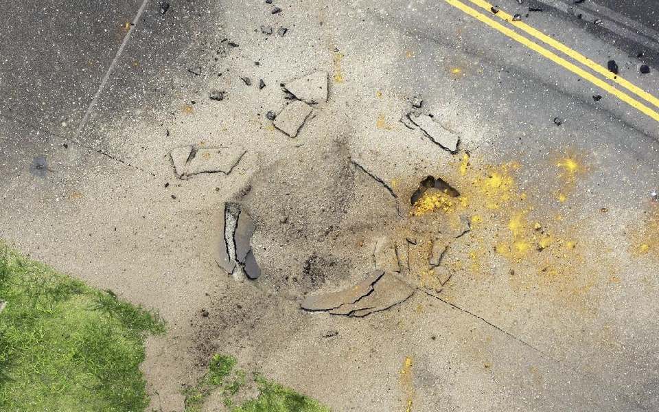 US bomb from World War II explodes at Japanese airport, causing large crater in taxiway