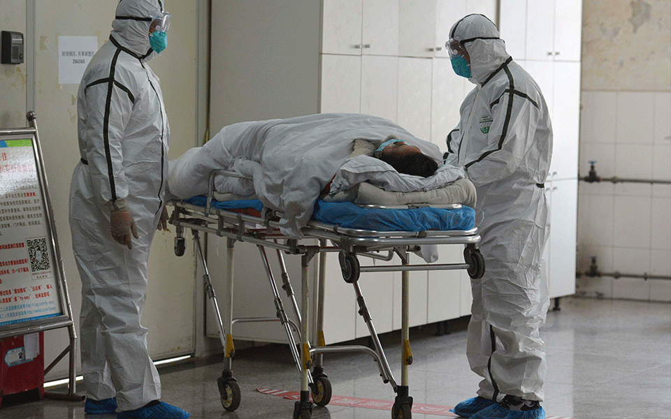 China reports 44 new virus deaths, lowest rise in new cases in over a month