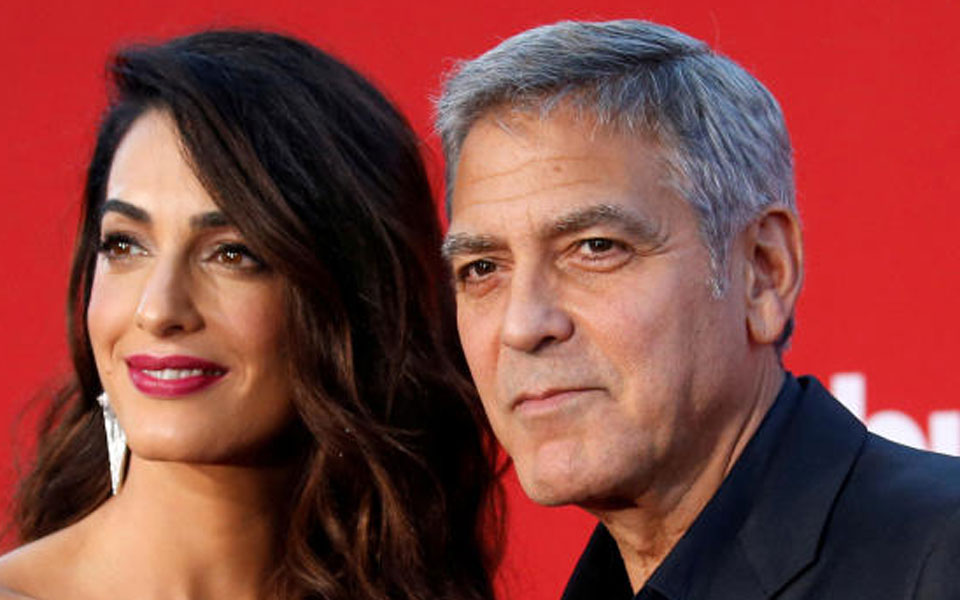 George Clooney, wife Amal donate $100,000 to migrant kids