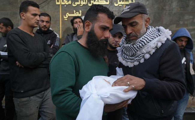 Israel strikes Gaza, killing 21 including women and children, after saying Hamas violated deal