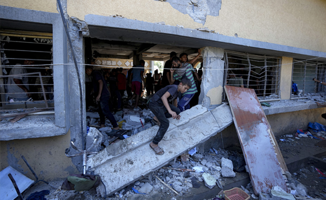 Israeli airstrike kills at least 20 people including children at school in central Gaza