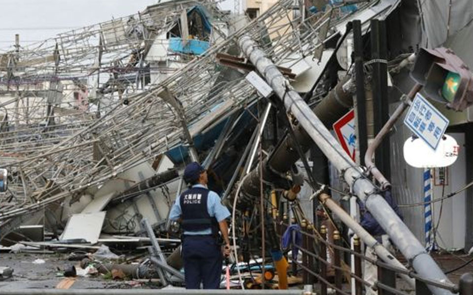 Japan typhoon leaves trail of destruction, 9 dead