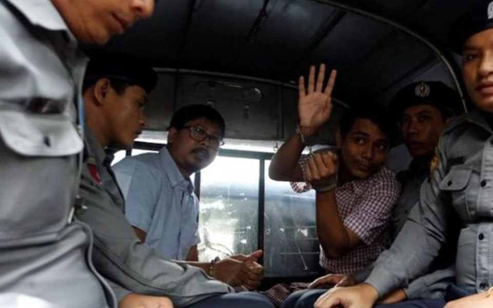 Myanmar charges Reuters reporters with illegally obtaining state secrets