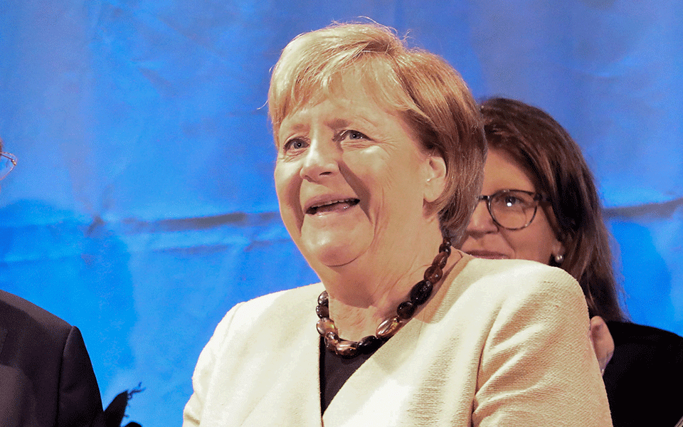 Social Democrats narrowly beat Angela Merkel's bloc in German vote