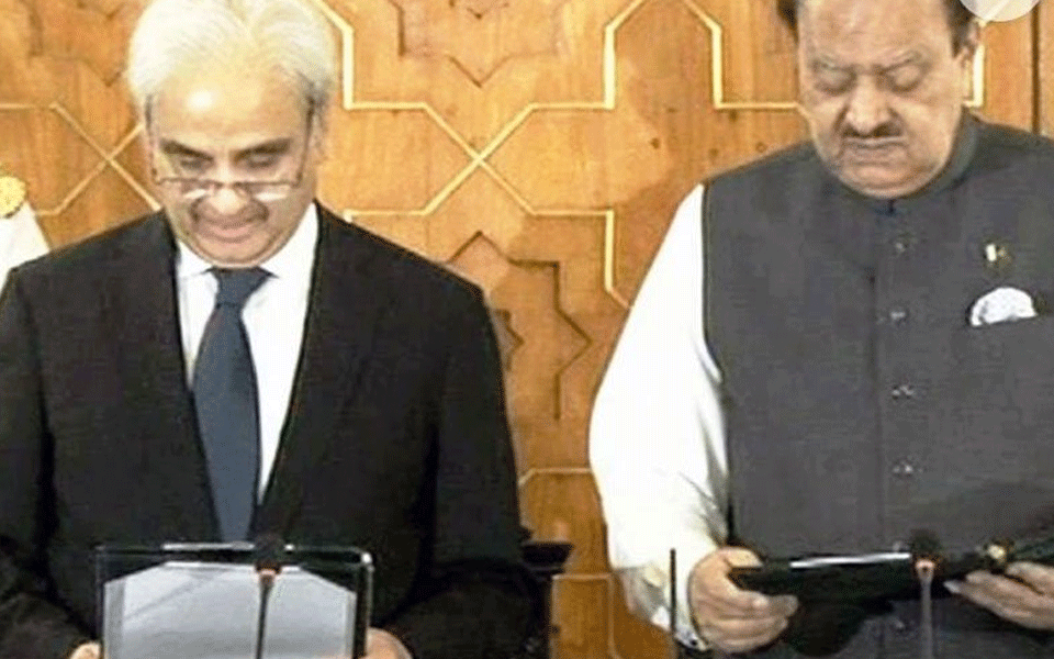 Pakistan's ex-Chief Justice takes oath as caretaker PM