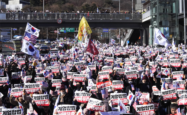 South Korea's impeached president defies warrant in hourslong standoff