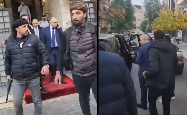 Video shows Syrian prime minister escorted by armed men