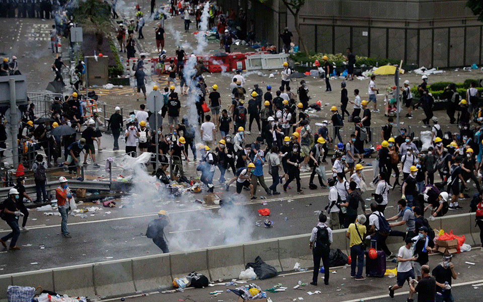 Hong Kong police use tear gas as protesters try to storm parliament