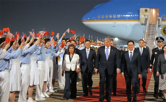 Trump arrives in China for talks with Xi